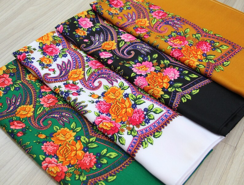 May include: Four fabric squares with a paisley floral pattern. The squares are in different colors: green, white, black, and yellow.