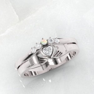 Claddagh ring. Diamond and opal claddagh ring. Gold claddagh ring. Engagement and wedding ring.