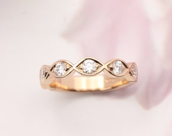 Wedding ring. Diamond wedding ring. Rose gold diamond ring.