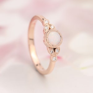 Opal engagement ring. Opal and diamond ring. Rose gold opal ring. Rose gold engagement ring.