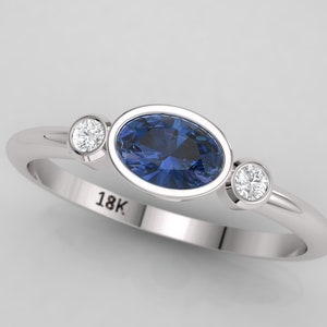 Sapphire engagement ring. Oval sapphire and diamond ring.