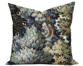May include: A square throw pillow featuring a woven tapestry design of a dense forest landscape. The pattern displays various trees and foliage in shades of dark navy blue, forest green, sage, and cream, creating a textured, detailed woodland scene.