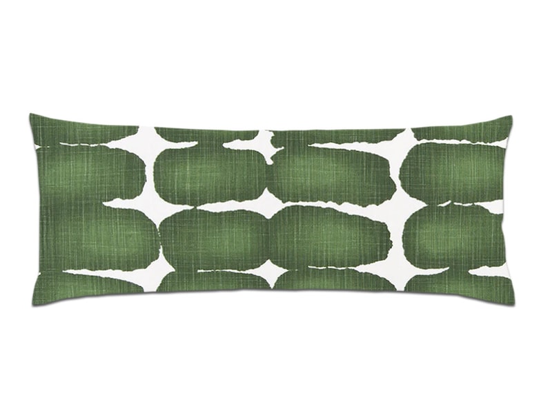 May include: A long, rectangular cushion with a white background and a green abstract pattern. The pattern is made up of irregular shapes that resemble stones or pebbles.
