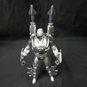 Figura de acción de Iron Man War Machine de Toy Biz Marvel con cañones en funcionamiento imagen 1