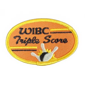 May include: Orange and yellow oval-shaped patch with the text "WIBC Triple Scores" and a black and white illustration of a bowling pin and hand.