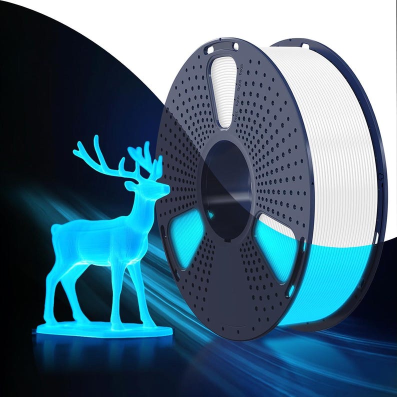 May include: A blue glowing 3D-printed deer figurine stands next to a spool of white filament. The filament spool is dark blue with a perforated design. The deer and the spool are illuminated with a blue light, creating a futuristic aesthetic.