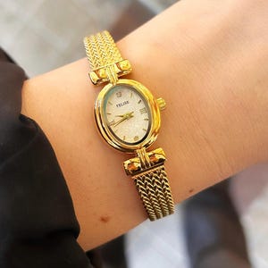 Dainty Gold Women&#39;s Watch: Minimalist Oval Dial, Adjustable Strap