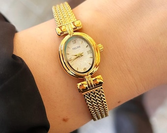 Reloj de oro delicado para mujer: esfera ovalada minimalista, correa ajustable