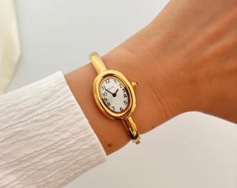 Reloj de pulsera dorado para mujer, reloj ovalado estilo pulsera