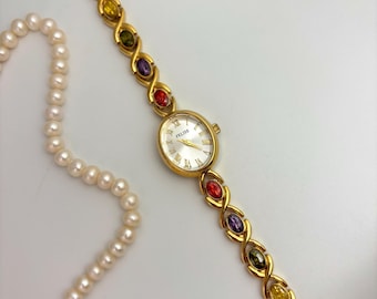 Vintage Gold Gemstone Watch: Roman Numeral Dial, Rainbow Bracelet