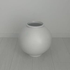May include: A spherical vase with a smooth, matte white finish. The vessel features a wide, rounded body that tapers slightly toward a circular opening at the top. The design is simple and uniform, showcasing a clean, solid white color throughout.