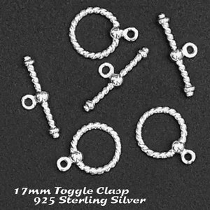 May include: Five silver toggle clasps with a rope-like design. The clasps are 17mm in size and are made of 925 sterling silver.