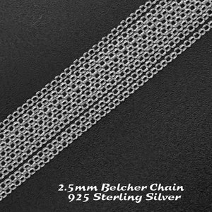 May include: A close-up of a silver 2.5mm Belcher chain made of 925 Sterling Silver. The chain is laid out on a black surface.