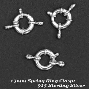 May include: Three silver 13mm spring ring clasps made of 925 sterling silver.