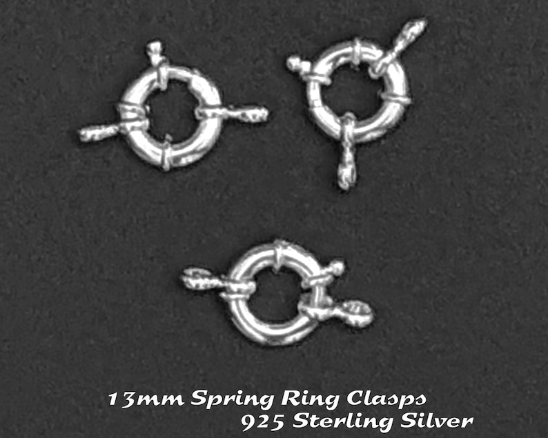 May include: Three silver 13mm spring ring clasps made of 925 sterling silver.