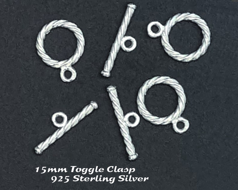 May include: Five silver toggle clasps, each with a twisted rope design. The clasps are 15mm in size and made of 925 sterling silver.