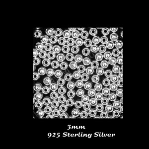 May include: A close-up image of a pile of small, round, silver beads. The beads are 3mm in diameter and are made of 925 sterling silver.