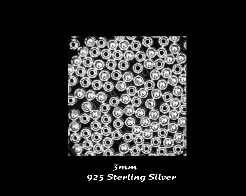 May include: A close-up image of a pile of small, round, silver beads. The beads are 3mm in diameter and are made of 925 sterling silver.