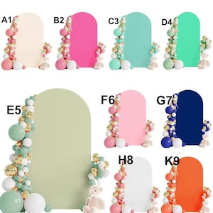 May include: Nine different colored arch backdrops with balloon garlands in pink, white, gold, and green. The backdrops are in cream, pink, mint green, light green, white, navy blue, and orange. Each backdrop has a small teddy bear in front of it.