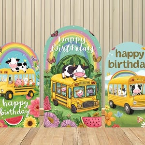 May include: Three arched backdrop panels featuring cartoon illustrations of yellow school buses, cows, rainbows, watermelons, and flowers. Each panel displays the text "happy birthday" in a stylized font, set against a vibrant, colorful outdoor scene.