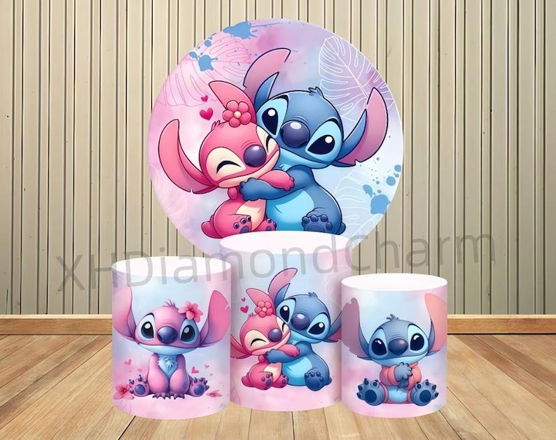 May include: A vibrant display featuring the characters Stitch and Angel from Lilo & Stitch. The design includes a large circular backdrop and three cylindrical stands, all adorned with the characters in a loving embrace, set against a pink and blue watercolor background.