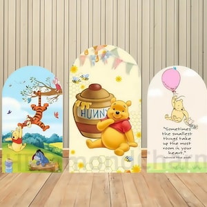 May include: Three arched panels featuring Winnie the Pooh characters. One panel shows Pooh, Tigger, and Eeyore. Another shows Pooh with a honey pot. The last panel has Pooh with a balloon and a quote: "Sometimes the smallest things take up the most room in your heart."
