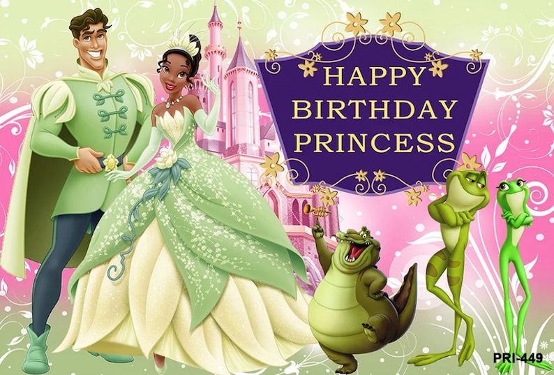 May include: A birthday card featuring a green and white princess and a prince in a green suit. The card has a purple banner with gold stars and the text 'HAPPY BIRTHDAY PRINCESS'. There are also two green frogs and a green alligator in the image.