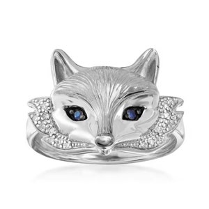 May include: Sterling silver ring featuring a fox head design with blue sapphire eyes and diamond accents.