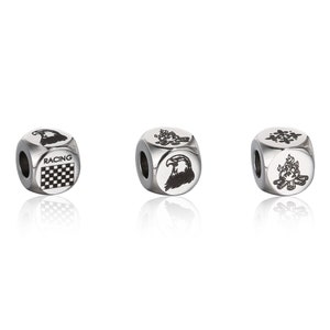 May include: Three silver metal dice with different designs. The first die has a checkered flag and the word "RACING" on it. The second die has an eagle head. The third die has a campfire with flames.