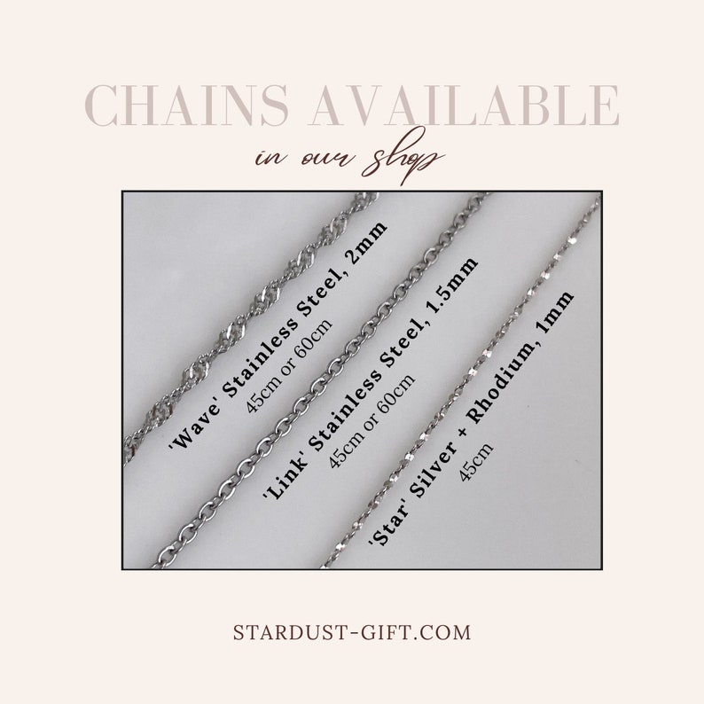 May include: Three silver-toned metal chains labeled as Wave Stainless Steel 2mm, Link Stainless Steel 1.5mm, and Star Silver + Rhodium 1mm. Text includes CHAINS AVAILABLE in our shop, specific lengths of 45cm or 60cm, and STARDUST-GIFT.COM.