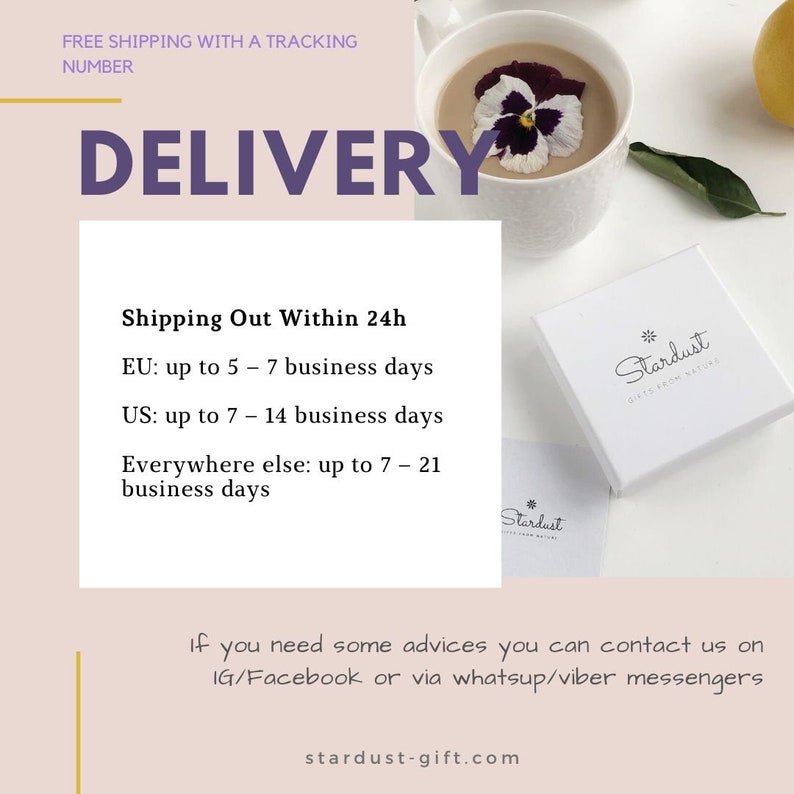 May include: A white square gift box featuring the Stardust Gifts From Nature logo, placed next to a white mug containing a beverage topped with a purple and white pansy flower. The image includes text regarding delivery times and contact information.