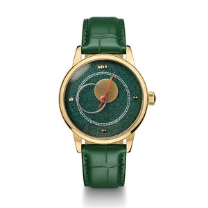 May include: A gold-toned wristwatch with a green face and a green leather band. The watch face features a gold circle, a red hand, and a white circular design. The watch has a gold-toned case and a green leather band.