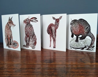 Pack of 4 linocut design wildlife greeting cards featuring a fox, deer, hare and otter.