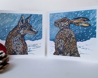 A pack of 8 Christmas cards of 2 linocut designs, featuring 'Snowfall Fox and 'Snowfall' Hare. Free UK postage