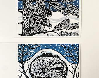 Pack of 8 linocut design Christmas cards featuring a sleeping badger and a red squirrel.