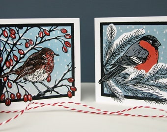 Pack of 8 Christmas Cards, 2 linocut bird designs featuring a robin and a bulfinch