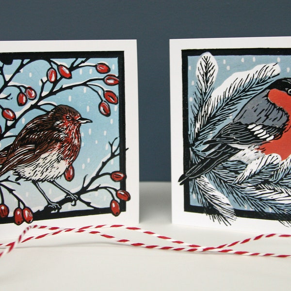 Pack of 8 Christmas Cards, 2 linocut bird designs featuring a robin and a bulfinch