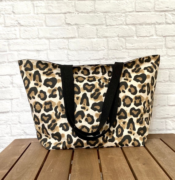 animal print travel tote bags Leopard Canvas Bag Zipper, Waterproof Pockets Beach  Starcove Fashion Exterior is made of Polyester and Cotton with faux leather accents Interior is made of Poly Twill lining Leopard Spots colorway has a faux hair feel Measures approximately 18 inches wide by 12 inches tall and 5 inches deep Approximately 9.5 Animal Print Travel Bag Travel