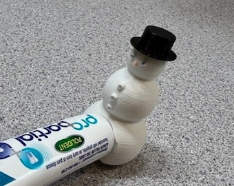 Pooping Snowman Tooth Paste Topper