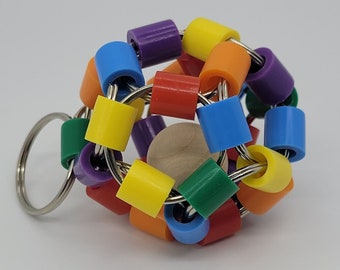 Juguete antiestrés ruidoso con forma de dodecágono / Juguete antiestrés con forma de D12 / ¡16 opciones de color!