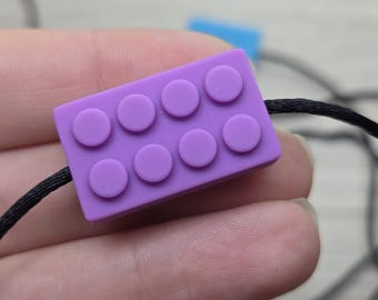 Naszyjnik Fidget z silikonu w kształcie cegły