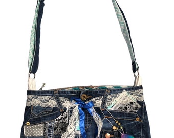 May include: A blue denim patchwork crossbody bag with a white lace trim, a blue ribbon bow, and a turquoise and white patterned strap.