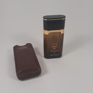 Vintage parfumflesje Must van Cartier leeg parfumverzameling