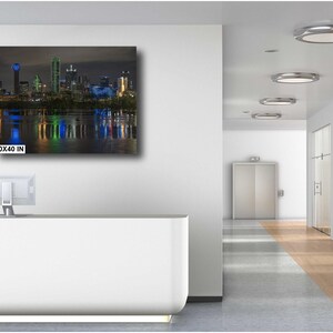 May include: A nighttime cityscape with skyscrapers reflected in the water. The image is a print measuring 30x40 inches.