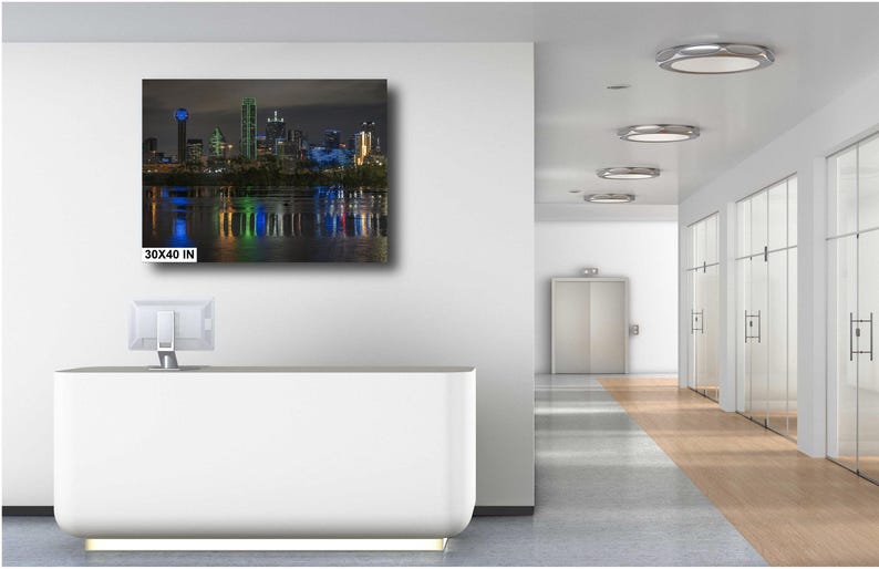 May include: A nighttime cityscape with skyscrapers reflected in the water. The image is a print measuring 30x40 inches.