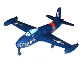 May include: A blue and white model airplane with the text "Navy" and "104" on the side. The airplane has a red stripe on the tail and a white star on the wing.