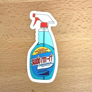 May include: A blue and white sticker of a spray bottle with the text "sudo rm-rf ORIGINAL Gone Forever!" and "DATA CLEANER WITH MORE SPEED".