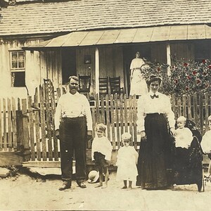 Small family photo in front of house. A bit of red hand tinting. Trike. Large format vintage original cabinet card photograph, unidentified.