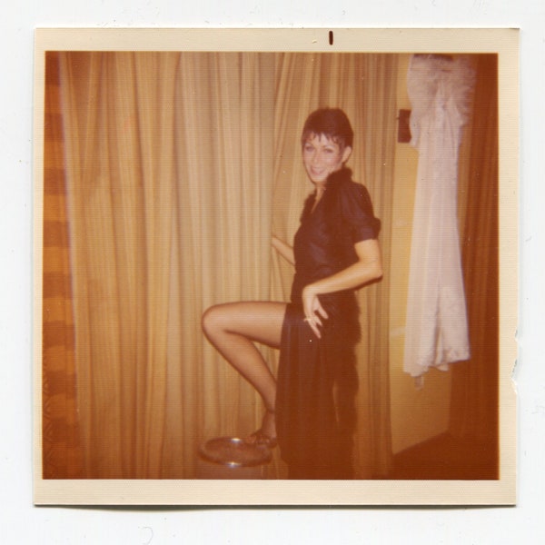 Let's go dancing! Woman in black dress showing some leg. 1970s original vintage color vernacular snapshot photo