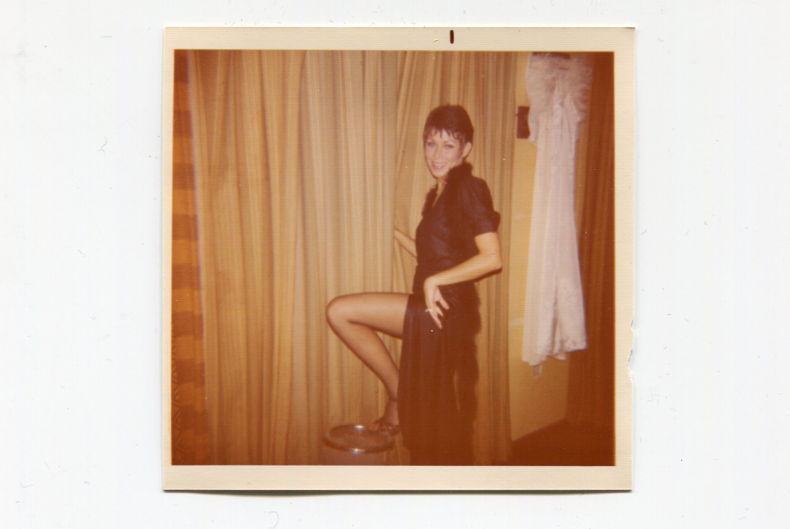 Let's go dancing! Woman in black dress showing some leg. 1970s original vintage color vernacular snapshot photo
